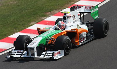 Who finished second in the 2009 Belgian Grand Prix, earning Force India's first podium?