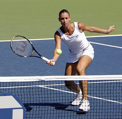 Which tournament did Flavia Pennetta win in 2014, defeating the top two seeds?