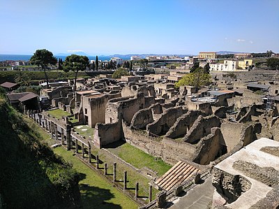 What type of objects were preserved in Herculaneum due to the pyroclastic material?