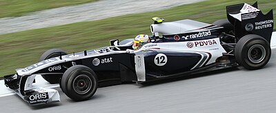 Which engine manufacturer powered Maldonado's car in his winning race?