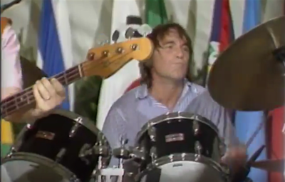 What instrument did Dennis Wilson primarily play in the Beach Boys?