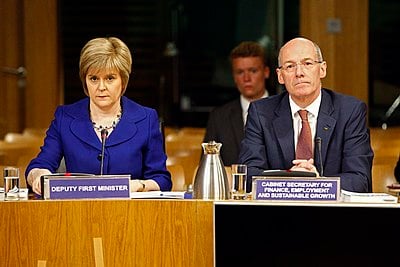In which year did Nicola Sturgeon withdraw from the SNP leadership contest in favor of Alex Salmond?