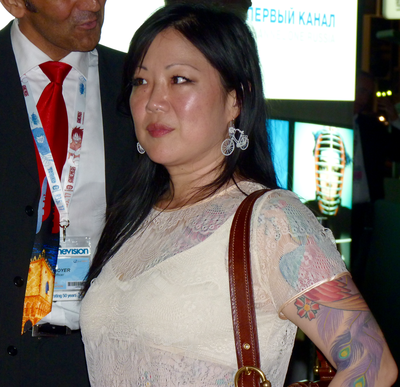 Apart from acting and comedy, Margaret Cho has interest in which field?
