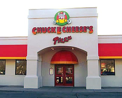 What type of play equipment was commonly found at Chuck E. Cheese locations in the past?
