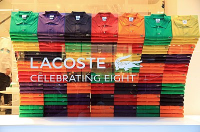 What is the primary material used in Lacoste's clothing products?