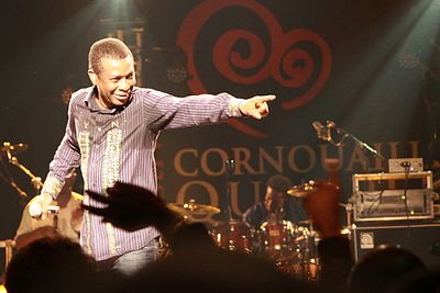 Youssou N'Dour's music has origins in which tradition?