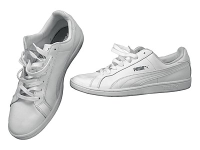 What is Puma's distinctive design feature introduced in 1958?