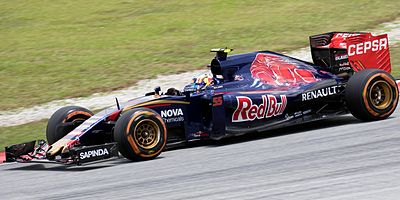 In what place did Carlos Sainz Jr. finish his first Formula 1 race?