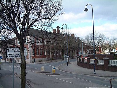 Which town is the primary commercial centre of Stoke-on-Trent?
