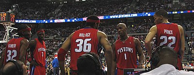 Which Detroit Pistons player won the NBA Defensive Player of the Year award four times?