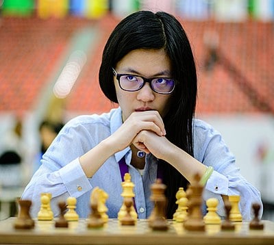 How many points ahead was Hou Yifan of the No. 2 ranked woman in September 2023?