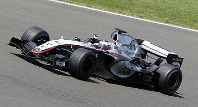 Along with which driver, Montoya has won two legs of the Triple Crown of Motorsport in its more recent definition?