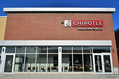 In which year did Chipotle announce the relocation of their corporate headquarters to Newport Beach, California?