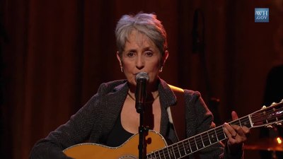 Which civil rights activist's song "We Shall Overcome" did Joan Baez famously cover?