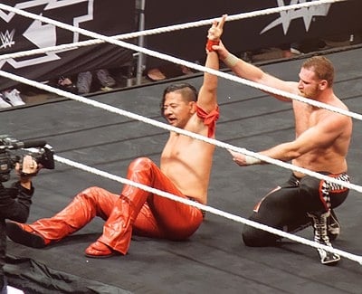 Which title did Nakamura first win in WWE?