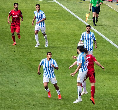 What is the name of Málaga CF's home stadium?
