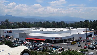 In which country did Costco open its first warehouse?