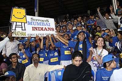 Who is the owner of Mumbai Indians' parent company, Reliance Industries?