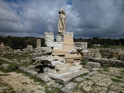 Which modern-day country is the ancient city of Cyrene located in?