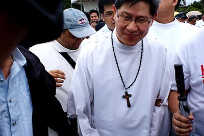 Luis Antonio Tagle is a defender of the Church's opposition to what?