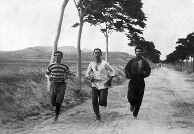 What year did Charilaos Vasilakos win his first marathon?