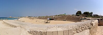 What was the primary language spoken in Caesarea Maritima during the Roman period?