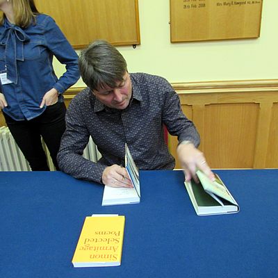 Where does Simon Armitage serve as a professor of poetry?