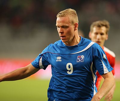 Which country did Iceland face in the playoffs for the 2014 FIFA World Cup qualification?