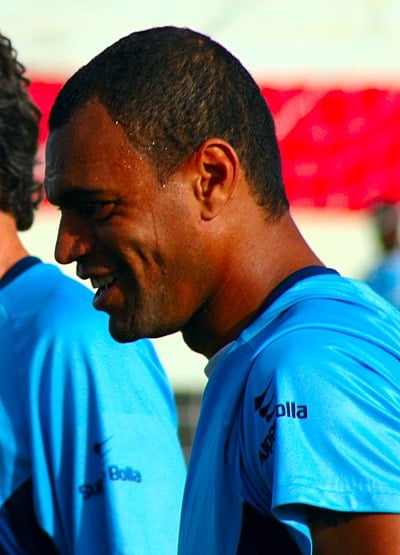 During which international tournament did Denílson make his debut for Brazil?
