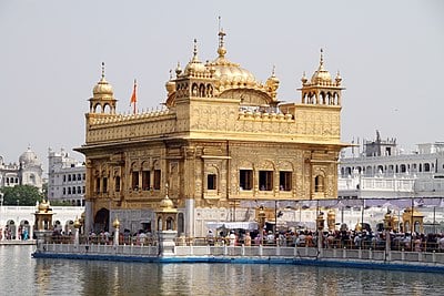 How far is Amritsar from the capital city of India, New Delhi?