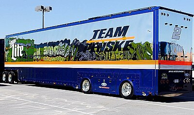 In which year did Team Penske debut in professional auto racing?
