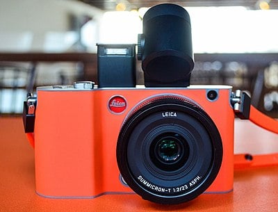 What type of optical equipment does Leica manufacture besides cameras?