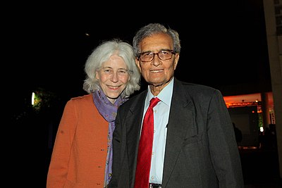 What is the name of the university professorship Amartya Sen holds at Harvard University?