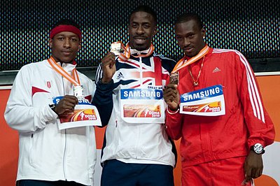 Who did Dwain team up with for the 4x100 m relay event?