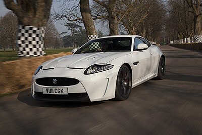 Which car model marked Jaguar's entry into the sports car market?
