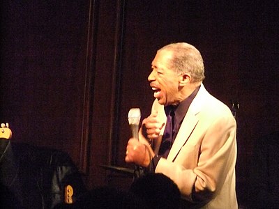 Which song of Ben E. King's pertains to a New York City neighborhood?