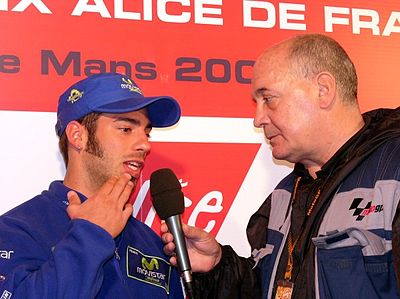 In which class did Melandri become World Champion in 2002?