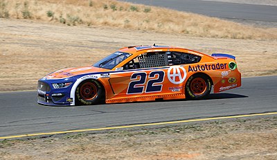 In which year did Logano become a NASCAR Cup Series champion for the first time?