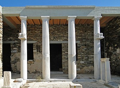 What is the name of the mountain on Delos with a sanctuary dedicated to Zeus?