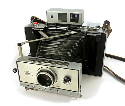 Which company started producing instant film for older Polaroid cameras in 2008?