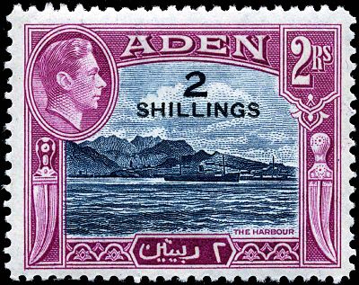 What unique geological feature does Aden's natural harbor lie in?