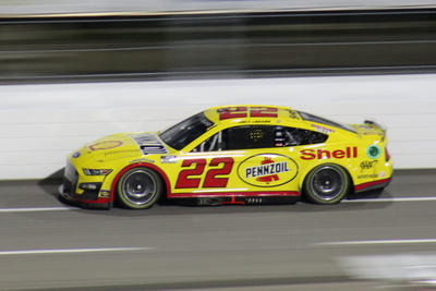 What distinction does Joey Logano hold among drivers born in the 1990s?