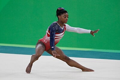 Can you tell me what nationalities Simone Biles holds?[br](Select 2 answers)
