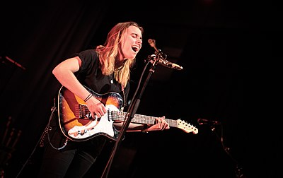 What thematic element is often featured in Julien Baker's lyrics?