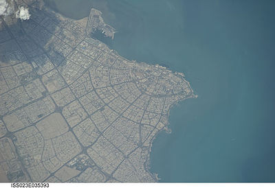 How many governorates of Kuwait comprise parts of Kuwait City's urban agglomeration?