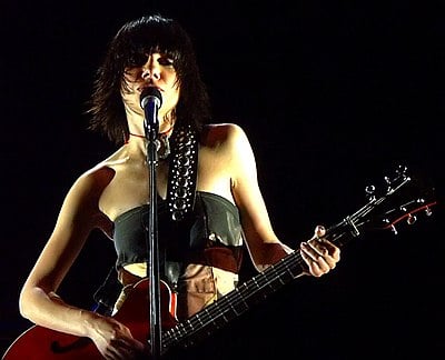 When did PJ Harvey win Rolling Stone's Artist of the Year?