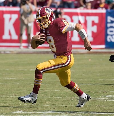 Which head coach drafted Cousins to the Redskins in 2012?