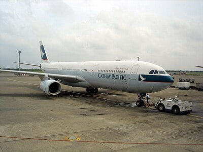 Which alliance is Cathay Pacific a founding member of?
