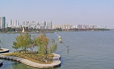 What is the population of Suzhou's administrative area as of the 2020 census?