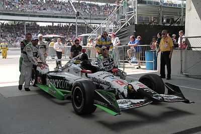 How many total wins does Bourdais have in American open-wheel car racing?